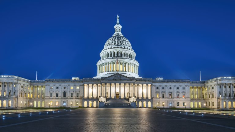 Picture of the front of the United States Capitol in the dusk